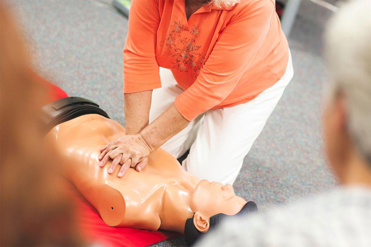 Practicing CPR on a manikin